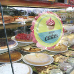 display of delicious looking cakes in a street bar